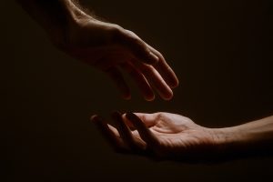 persons hand forming heart
